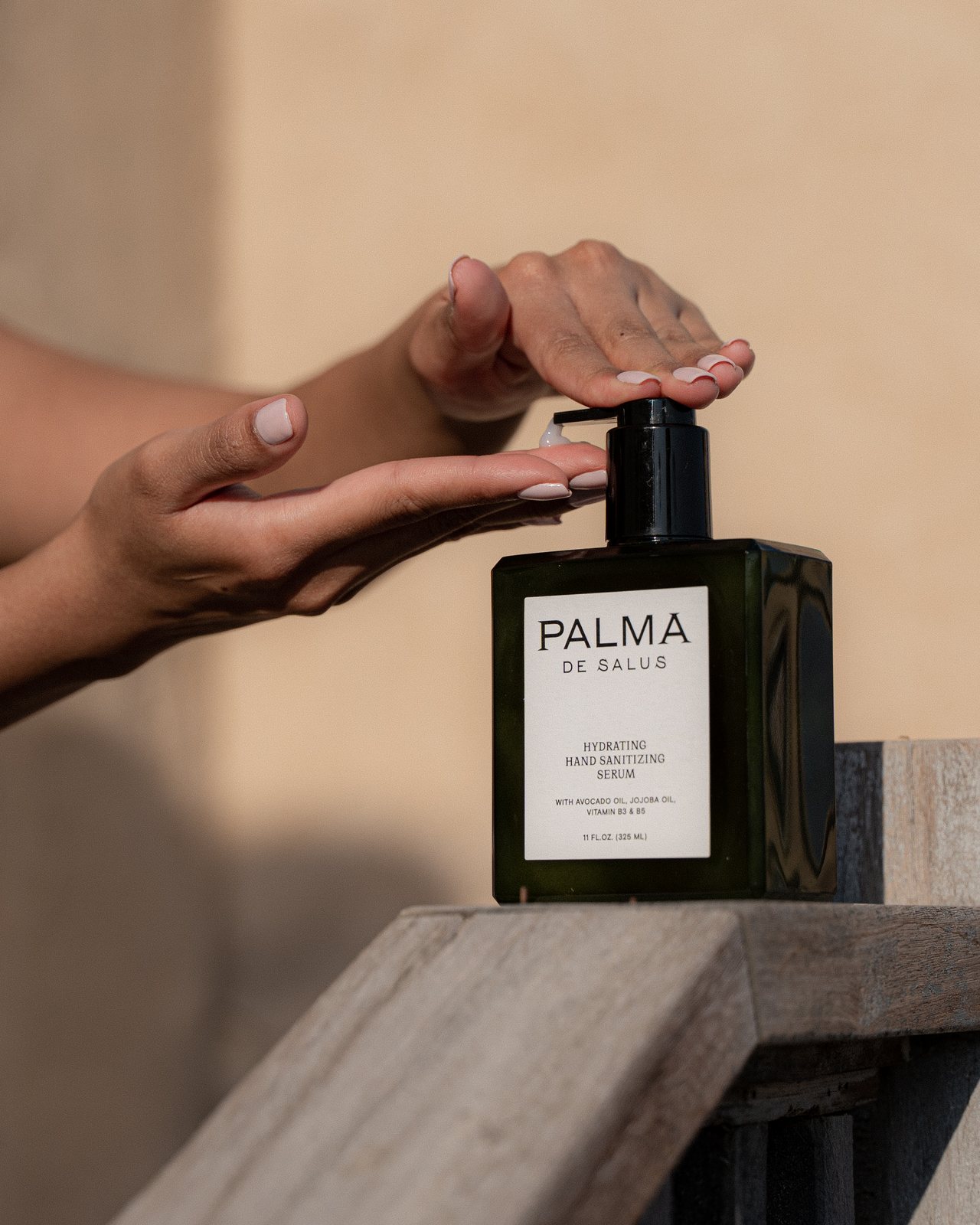 Pressing the serum pump into an open palm