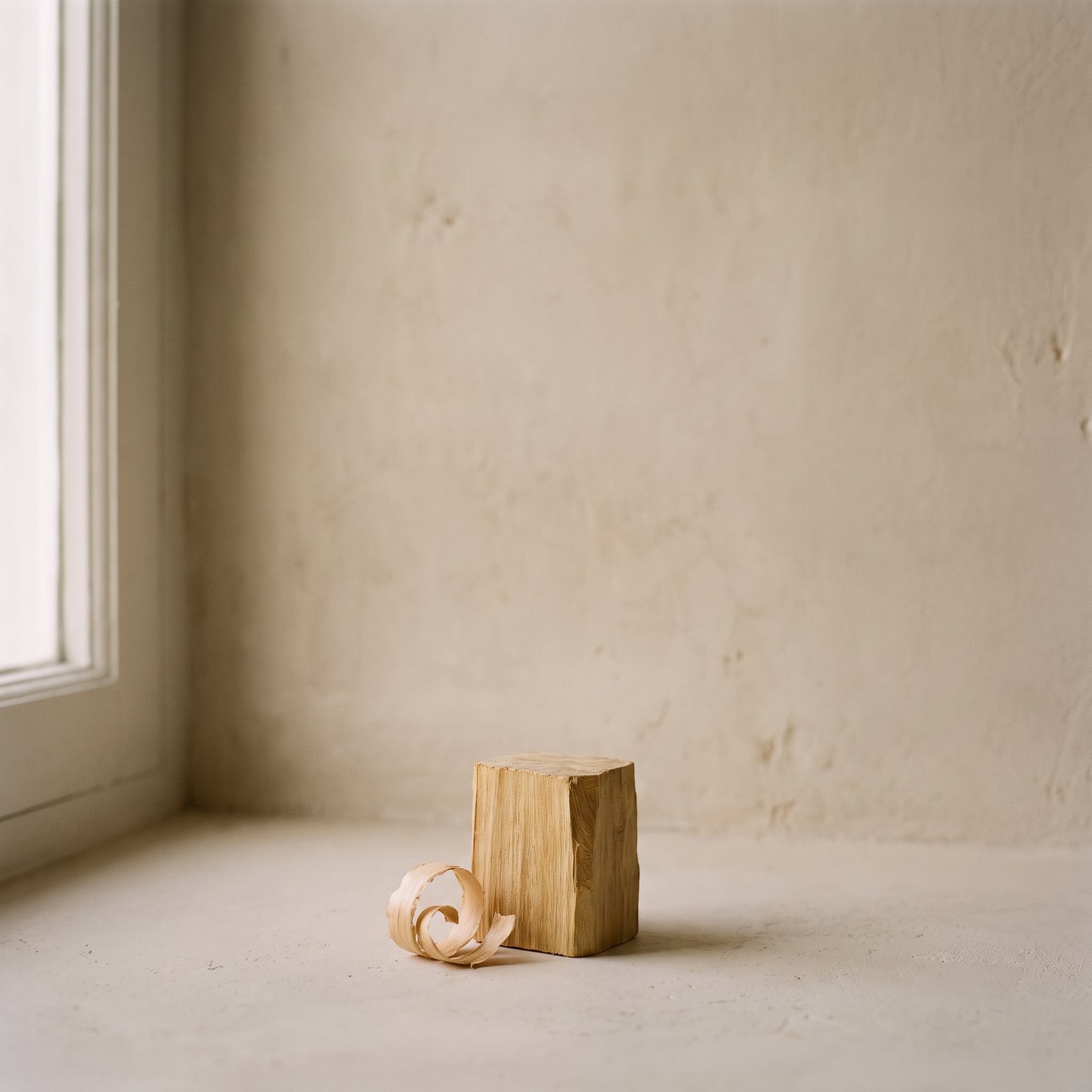 A block of sandalwood with a fresh shaving